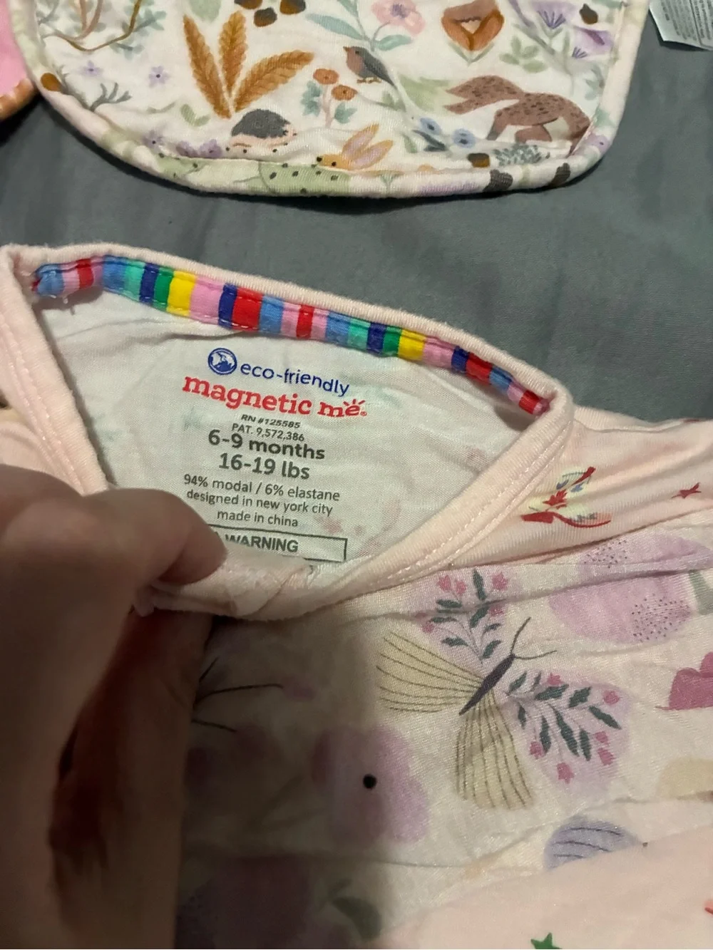 3 magnetic me modal footsies and 6 magnetic me bibs.